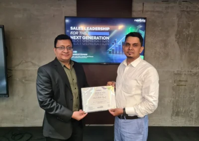 Sales leadership training participant receiving certificate in Dhaka