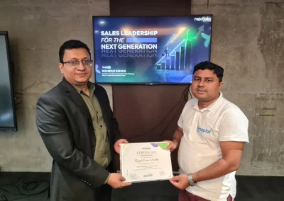 Participant receiving certificate from sales leadership training Bangladesh