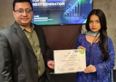 Participants holding certificates after completing sales leadership training